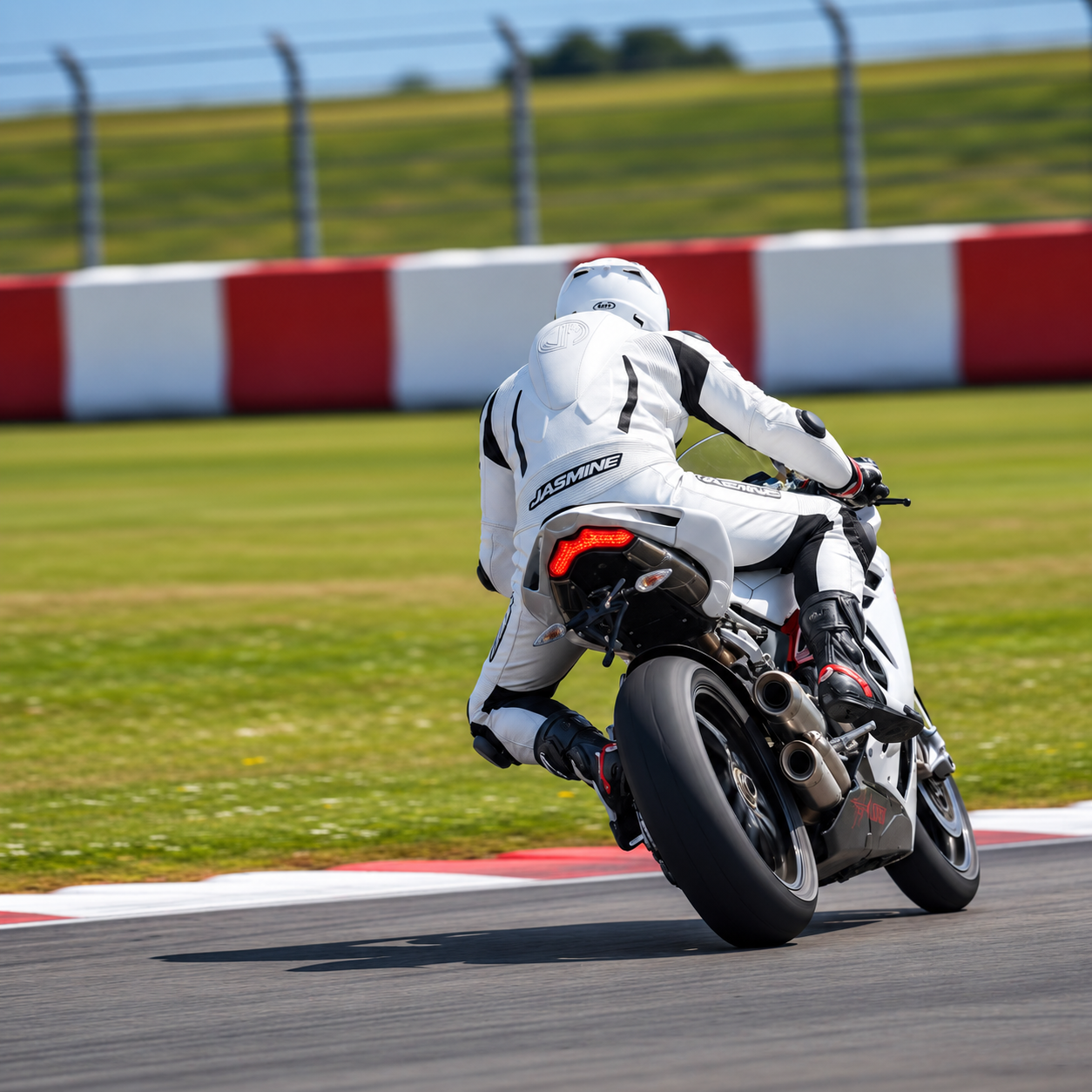 Rider in white racing leathers